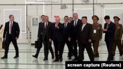 utin and Kim review rocket launch sites at Russia's Vostochny Cosmodrome